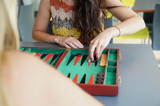 Playing backgammon at a colorful table captures focus and strategy
