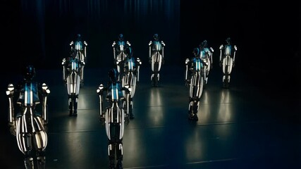 A group of robotic performers showcases impressive choreography with fluid, synchronized dancing under vibrant lighting in a modern event space - Powered by Adobe