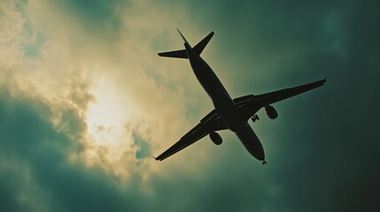 Fototapeta premium A commercial airliner soaring through a cloudy atmosphere, ideal for travel or transportation concepts