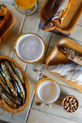 Beer glasses with different snacks.