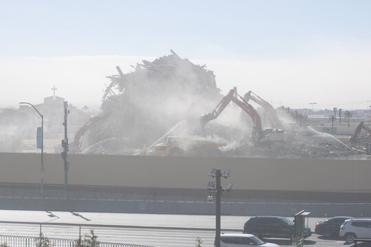 Las Vegas, NV, USA - Oct 28, 2024: Construction workers keep spraying water over the rubbles to be removed at the demolition site of Tropicana Las Vegas. The building was imploded on October 9, 2024.
