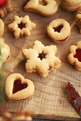Homemade Linzer Christmas cookies filled with marmalade