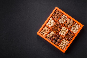 Box with various nuts cashew, macadamia, peanut, cedar, pecan, walnut, brazil, hazelnut