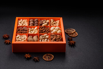 Box with various nuts cashew, macadamia, peanut, cedar, pecan, walnut, brazil, hazelnut