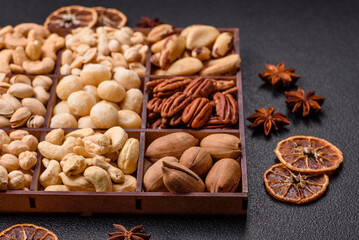 Box with various nuts cashew, macadamia, peanut, cedar, pecan, walnut, brazil, hazelnut