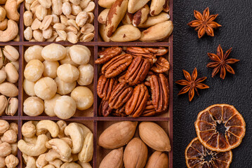 Box with various nuts cashew, macadamia, peanut, cedar, pecan, walnut, brazil, hazelnut