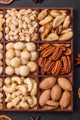 Box with various nuts cashew, macadamia, peanut, cedar, pecan, walnut, brazil, hazelnut