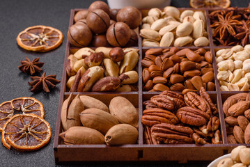 Box with various nuts cashew, macadamia, peanut, cedar, pecan, walnut, brazil, hazelnut
