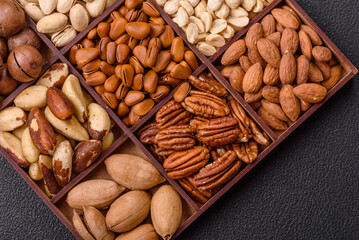 Box with various nuts cashew, macadamia, peanut, cedar, pecan, walnut, brazil, hazelnut