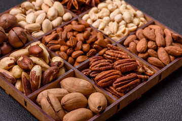 Box with various nuts cashew, macadamia, peanut, cedar, pecan, walnut, brazil, hazelnut