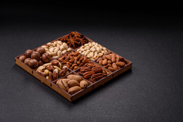 Box with various nuts cashew, macadamia, peanut, cedar, pecan, walnut, brazil, hazelnut
