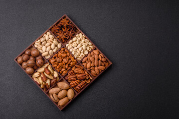 Box with various nuts cashew, macadamia, peanut, cedar, pecan, walnut, brazil, hazelnut