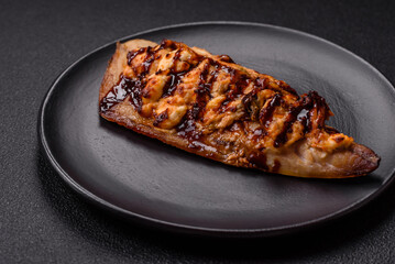 Grilled mackerel fillets with cheese, salt, spices and herbs