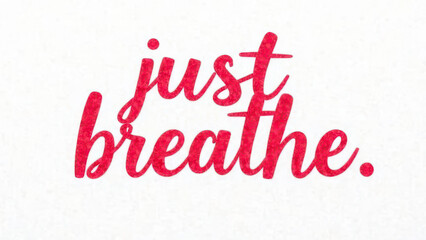Inspirational red "just breathe" text on white background