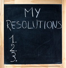 Numbered list my resolutions handwritten blackboard chalkboard. Blackboard with numbered list of my resolutions written on it isolated on white background