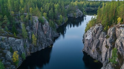view from above the river with steep rocks in the middle of the forest