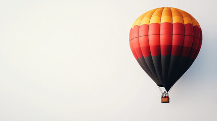 Naklejka premium Red, orange, and black hot air balloon against a white background.