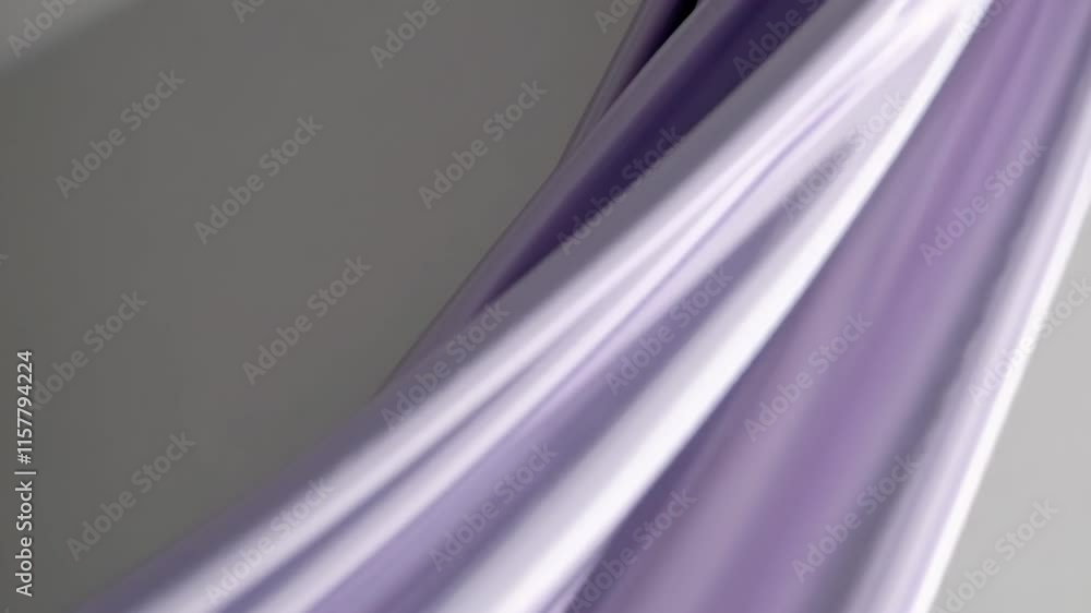 Poster flowing lavender fabric with smooth drapes, creating a soft and airy appearance.