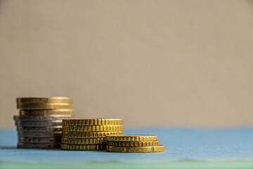 Stack of euro coins on table, side view
