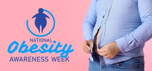 Young overweight man putting on tight shirt against pink background, closeup. Banner for National Obesity Awareness Week