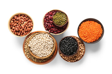 Bowls with different legumes isolated on white background