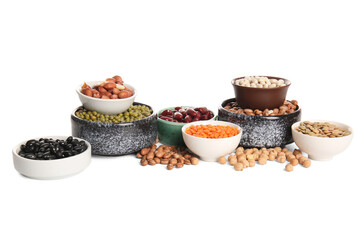 Composition with bowls of different raw legumes on white background