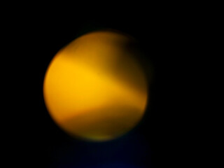 Abstract light leak effect on dark background for creating special effects. The colors are vibrant and the circles are overlapping, creating a sense of movement and energy. Abstract art.