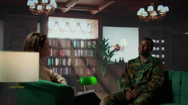 Armed forces officer discussing about his war memories during counseling session, joining a rehabilitation program for soldiers. Trooper opening up about PTSD and trauma. Camera B.