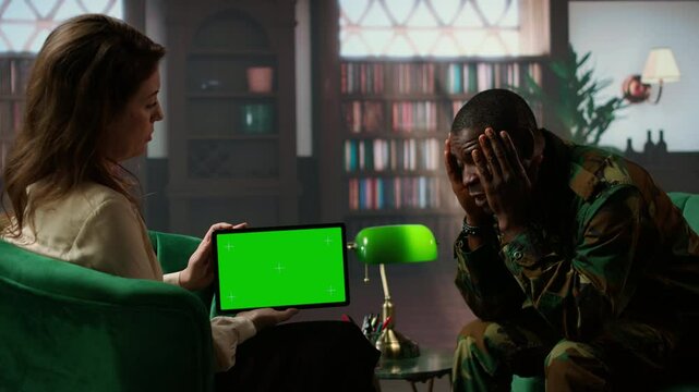 Military personnel confronting war related distress next to copy space, discuss about psychological issues and infantry shell shock syndrome. Veteran listening to advice from counselor. Camera A.