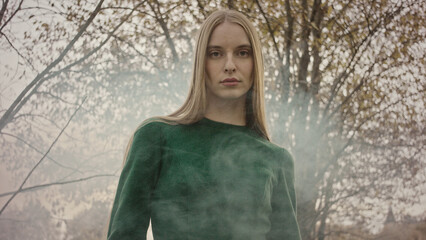 Fashion model posing in a mysterious forest