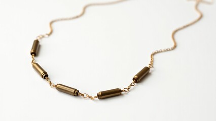Fototapeta premium Unique necklace crafted from polished .22 caliber bullets and a fine gold chain. Edgy and elegant, this piece blends industrial style with modern sophistication