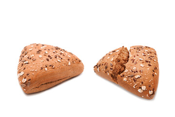 Fitness bread. Broken and the whole loaf of organic bran bread with seeds and sesame isolated on white background. Assortment of bakery products.	