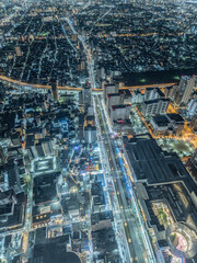 Top view of an Asian big city and many cars crossing at night, Abeno Harukas Observatory in Osaka in Japan, Travel or business, High resolution over 50MP