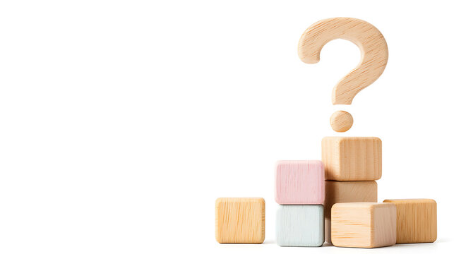 Wooden blocks arranged with question mark above, symbolizing inquiry and curiosity