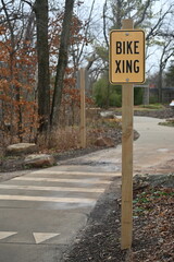 Bike Xing sign on paved trail