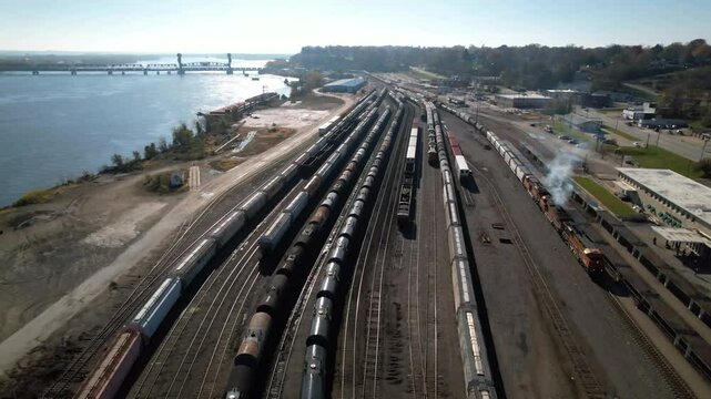 IOWA - 12.5.2024 - Amazing aerial footage of a train traveling out of a freight yard on the Mississippi.