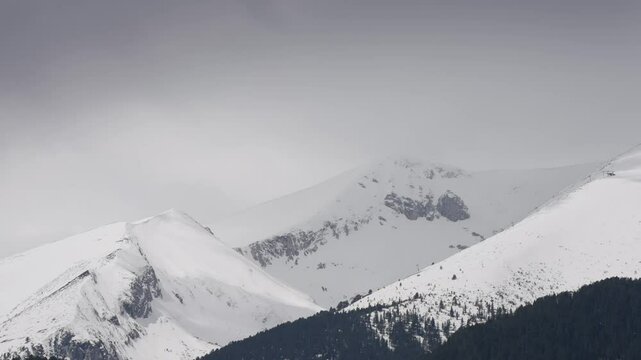 A breathtaking panoramic view showcasing the majestic snow-covered mountainpeak Vihren  at Piring mountian, near Bansko, Bulgaria, perfect for winter enthusiasts.
