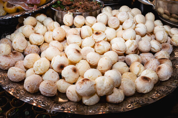 tray with cheese bread, typical Brazilian biscuit made with baked cheese, traditional food in Minas Gerais