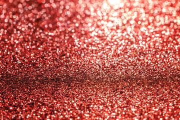 A red background with a lot of glitter