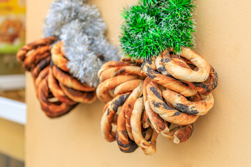 Three different shaped breads hanging on a wall
