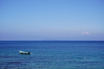 Naklejka premium Genkaishima - boat on the sea