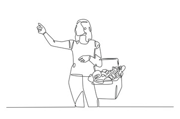 Woman carrying shopping basket continuous one line drawing. Woman holding basket with fresh organic vegetables in single line art illustration. Editable vector.