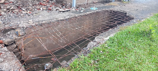The sidewalks have collapsed, leaving only the metal supporting the road after the natural disaster
