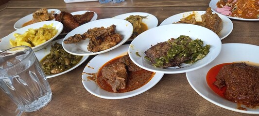 traditional West Sumatran dishes served at the table