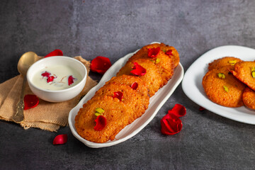 Malpua is a traditional Indian sweet made of flour, sugar, and coconut, deep-fried into crispy pancakes, often served with cardamom syrup or milk.