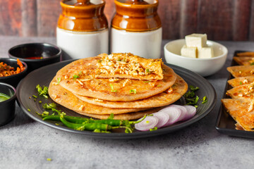 Paneer ka paratha is a delicious Indian flatbread stuffed with spiced paneer, served hot with...