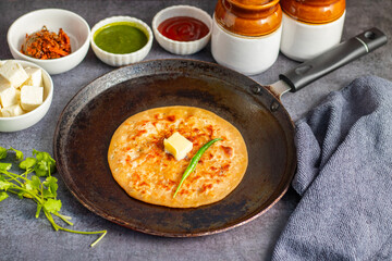 Paneer ka paratha is a delicious Indian flatbread stuffed with spiced paneer, served hot with chutney, curd, or pickle.