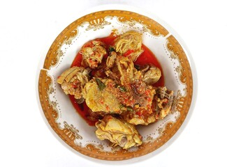 Ayam Woku, a typical chicken dish from Manado, North Sulawesi, Indonesia. Which has a rich aroma and a spicy taste. Isolated on white background.