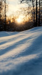 Fototapeta premium Snow-covered landscape at sunset, showcasing gentle undulations and soft light.