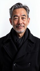 Asian man in black wool coat on white background. For business and formal wear.